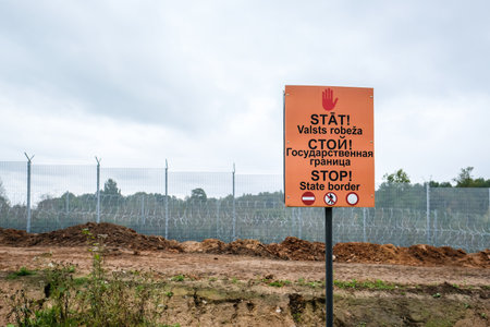 Robeznieki, Latvia - September 14, 2022: Latvia - Belarus border, where a fence is being built against illegal refugees entering the European Union from the side of Belarusのeditorial素材