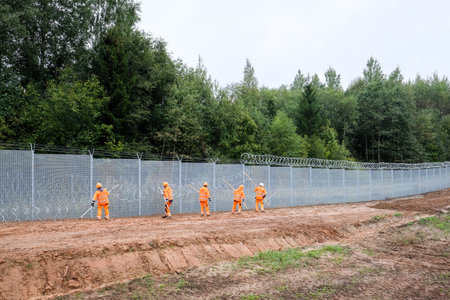 Robeznieki, Latvia - September 14, 2022: Latvia - Belarus border, where a fence is being built against illegal refugees entering the European Union from the side of Belarusのeditorial素材