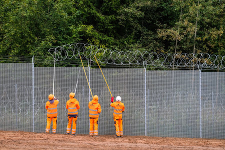 Robeznieki, Latvia - September 14, 2022: Latvia - Belarus border, where a fence is being built against illegal refugees entering the European Union from the side of Belarusのeditorial素材