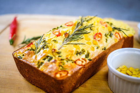 Freshly baked cornbread with red chili peppers. Defocusedの写真素材