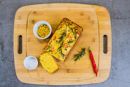 Freshly baked cornbread with red chili peppers. Defocusedの写真素材