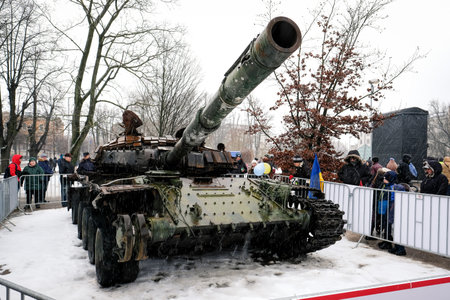 Riga, Latvia - February 25, 2023: Russian T-72B tank, which was destroyed by the Ukrainian army in the spring of 2022 in the battles near Kiev. It is placed in Riga, in front of the Russian embassy.のeditorial素材