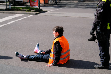 Berlin, Germany - April 24, 2023: Protesters from the group Last Generation sitting on the street...