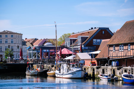 Wismar, Germany - May 8, 2023: Scenic summer outdoor view of the Old Port pier town architecture with ships and boats in Wismar, Germanyのeditorial素材