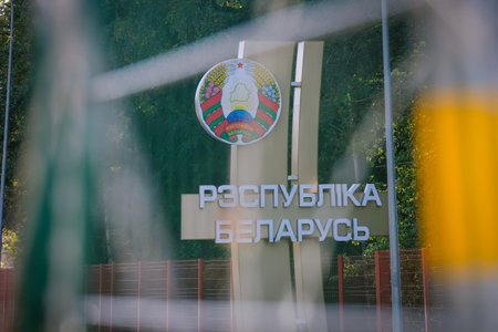 Silene, Latvia - September 26, 2023: Latvia - Belarus border, Belarus national emblem and coat of arms, barbed wireのeditorial素材