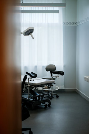 Office of a doctor urologist in a medical clinic with a specialized bedの写真素材