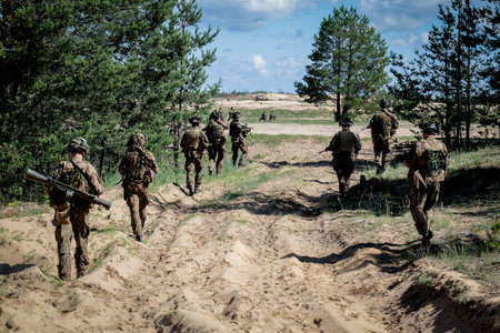 Adazi, Latvia- June 11, 2024: Soldiers and national guardsmen of the Latvian army train with weapons...