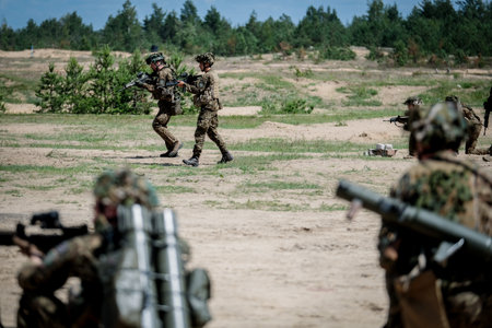 Adazi, Latvia- June 11, 2024: Soldiers and national guardsmen of the Latvian army train with weapons at the Adazi training ground. Latvia is a NATO country.のeditorial素材