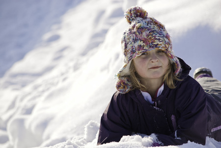 Portrait of Girl Playing in snowの写真素材