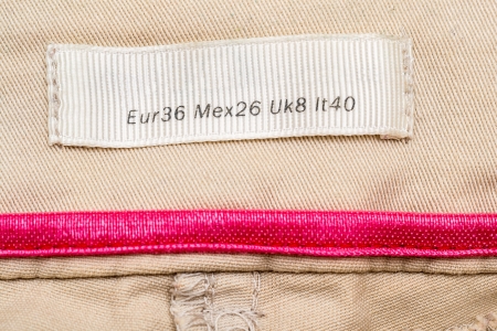 Macro Photo Of A Clothing Label Showing Medium Size (European, Mexican, United Kingdom and Italy Equivalents)の写真素材