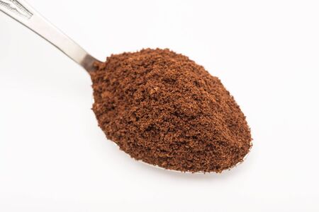 Spoon With Coffee On A White Backgroundの写真素材