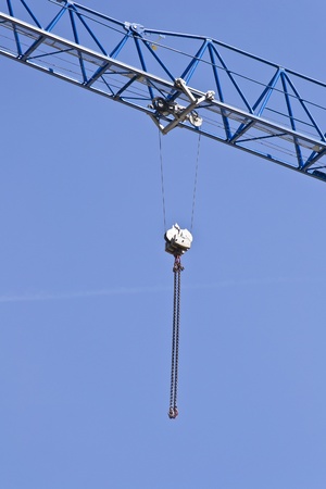 Pulley Hanging From A Crane On A Blue Skyの写真素材