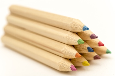 Closeup Of Ten Different Colored Crayons  10cm long  On Top Of One Another Forming A Pyramidの写真素材