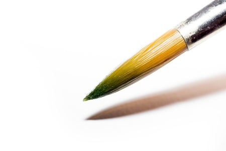 Macro Photo Of A Paintbrush Colored Tip On A White Background Preparing To Paintの写真素材