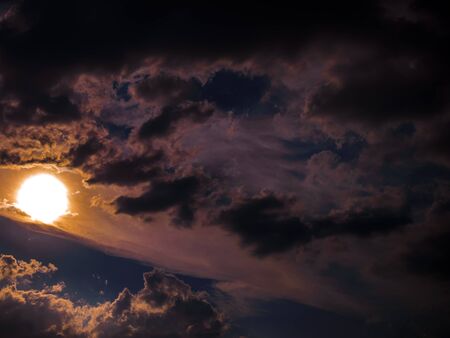 Beautiful Sunset Orange Colors On A Cloudy Dark Blue Skyの写真素材