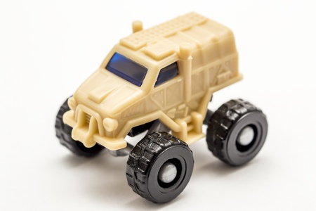 Closeup Photo Of An US Army Toy Car On A White Backgroundの写真素材