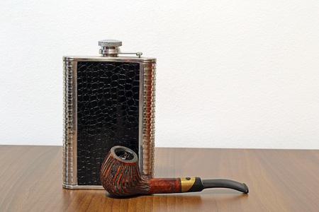 Pipe And Canteen On A Wooden Tableの写真素材
