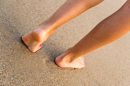 Young Girl Walking On The Beach