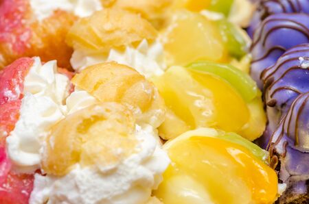 Multicolored Cookies With Whip Cream And Fruitsの写真素材