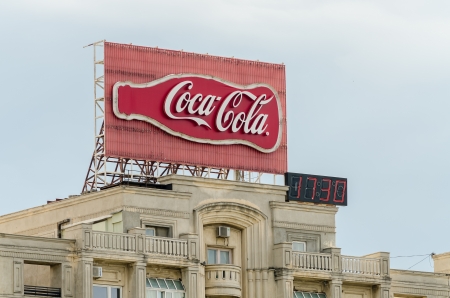 BUCHAREST, ROMANIA - JUNE 14: Coca-Cola advertising on June 14, 2013 in Bucharest, Romania. It is a carbonated soft drink sold in stores and restaurants in every country except Cuba and North Korea.のeditorial素材