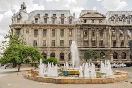 BUCHAREST, ROMANIA - JUNE 16: The University Square Fountain on June 16, 2013 in Bucharest, Romania. The Fountain is a symbol of The University Square, the place where the 1989 revolution took place.のeditorial素材