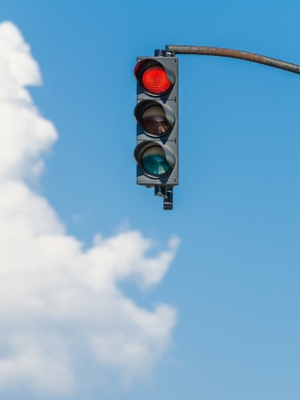 Red Traffic Light On Blue Skyの写真素材