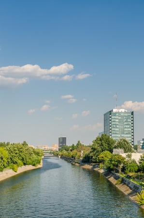 BUCHAREST, ROMANIA - JULY 23: Dambovita River on July 23, 2013 in Bucharest, Romania. It passes through Bucharest and flows into the Arges River 286 kilometers from its source.のeditorial素材