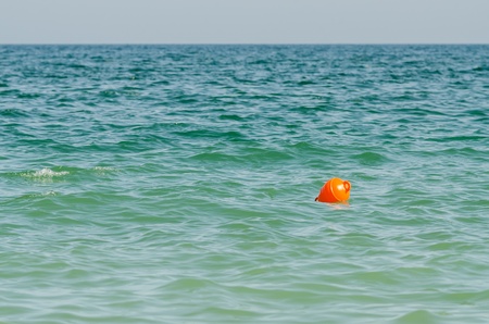 Orange Buoy In Oceanの写真素材