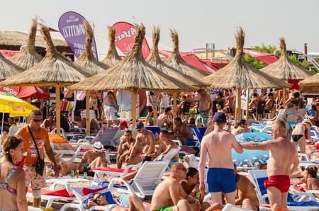 COSTINESTI, ROMANIA - AUGUST 06  People have fun at the Black Sea on August 06, 2013 in Costinesti, Romania  Costinesti is a commune and resort about 30 kilometers south of the county seat, Constanta のeditorial素材