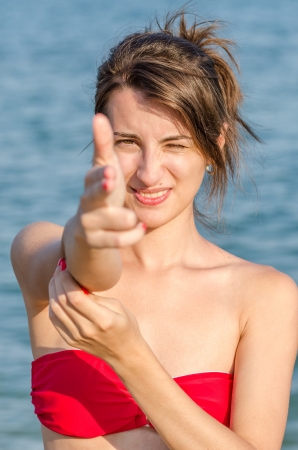 Beautiful Young Girl Hand Pretending To Pistol Shootの写真素材