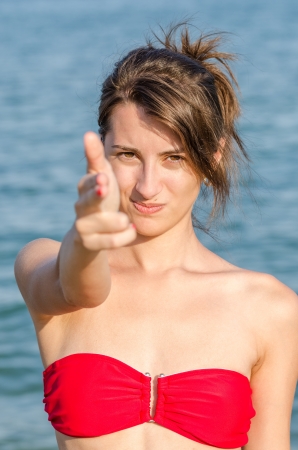 Beautiful Young Girl Hand Pretending To Pistol Shootの写真素材