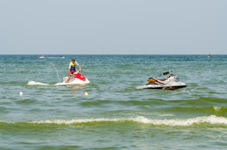 MAMAIA, ROMANIA - AUGUST 08  People having fun on sky-jet on August 08, 2013 in Mamaia, Romania  Riding the sky jet is one of the main attractions in the romanian resort Mamaia のeditorial素材