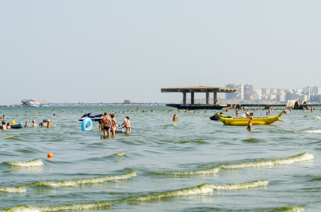 MAMAIA, ROMANIA - AUGUST 08  People have fun at the Black Sea on August 08, 2013 in Mamaia, Romania  Mamaia is considered to be the most popular romanian resort with 4 and 5 stars hotels のeditorial素材