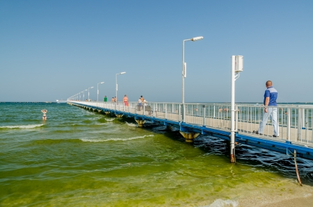 MAMAIA, ROMANIA - AUGUST 08  The Pontoon Bridge on August 08, 2013 in Mamaia, Romania  The Pontoon is one of the tourist atractions in Mamaia, with a lenght of 500 meters のeditorial素材