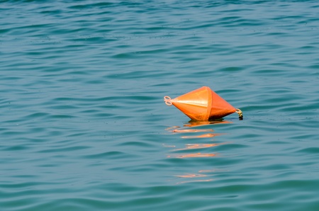 Orange Life Buoy In Ocean Close Upの写真素材