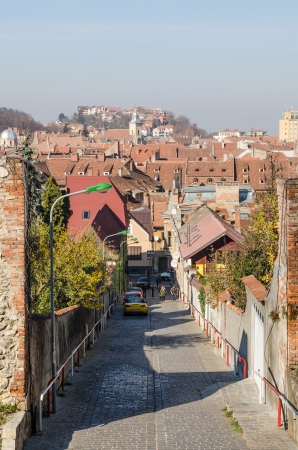 BRASOV, ROMANIA - NOVEMBER 02  Medieval Street on November 02, 2013 in Brasov, Romania  It has been the place for annual markets since 1364 being visited by merchants from the country and abroad のeditorial素材