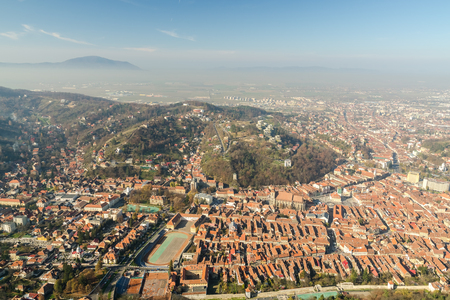 Aerial View Of Brasov City In The Carpathian Mountains Of Romaniaの写真素材