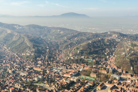 Aerial View Of Brasov City In The Carpathian Mountains Of Romaniaの写真素材
