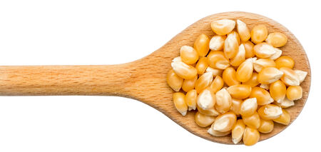 Wooden Spoon With Corn Seeds Isolatedの写真素材