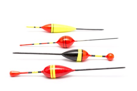 Red And Yellow Colored Fishing Corks Isolated On Whiteの写真素材