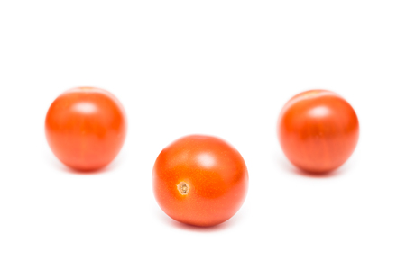 Red Cherry Tomatoes Isolated On Whiteの写真素材