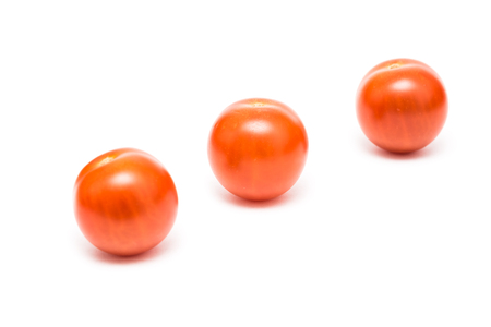 Red Cherry Tomatoes Isolated On Whiteの写真素材