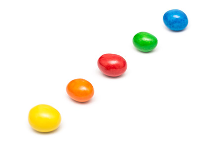 Colorful Row Of Coated Chocolate Candy Close Up Isolated On Whiteの写真素材
