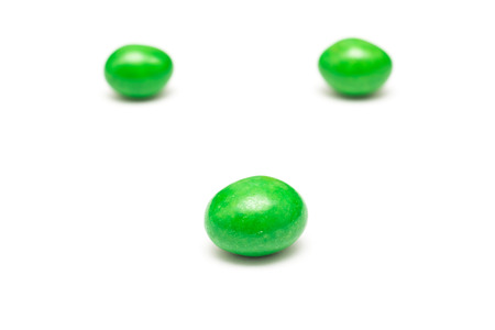 Green Coated Chocolate Candy Close Up Isolated On Whiteの写真素材