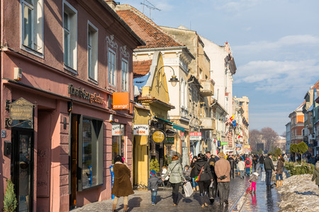 BRASOV, ROMANIA - FEBRUARY 09  Tourists Sightseeing Downtown on February 09, 2014 in Brasov, Romania  Brasov Is One Of The Main Touristic Cities Of Romania In The Carpathian Mountains のeditorial素材