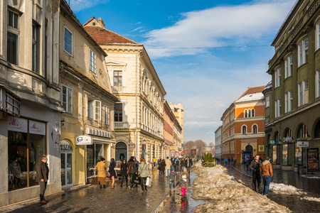 BRASOV, ROMANIA - FEBRUARY 09  Tourists Visiting Historical Old Center on February 09, 2014 in Brasov, Romania  Brasov Is One Of The Main Touristic Cities Of Romania In The Carpathian Mountains のeditorial素材