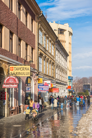 BRASOV, ROMANIA - FEBRUARY 09  Tourists Visiting Historical Old Center on February 09, 2014 in Brasov, Romania  Brasov Is One Of The Main Touristic Cities Of Romania In The Carpathian Mountains のeditorial素材