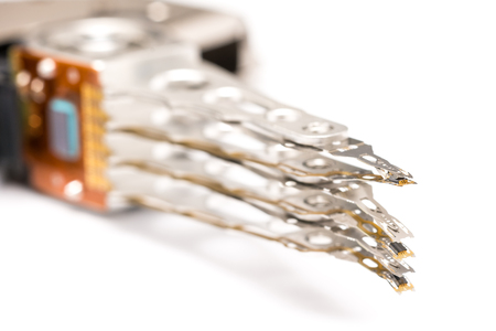 Computer Hard Disk Drive Actuator Close Up Isolated On Whiteの写真素材