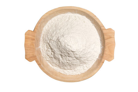 Wooden Bowl With Wheat Flour Powder Isolated On Whiteの写真素材