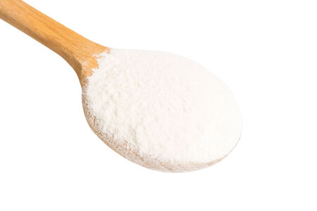 Wooden Spoon With Wheat Flour Powder Isolated On Whiteの写真素材